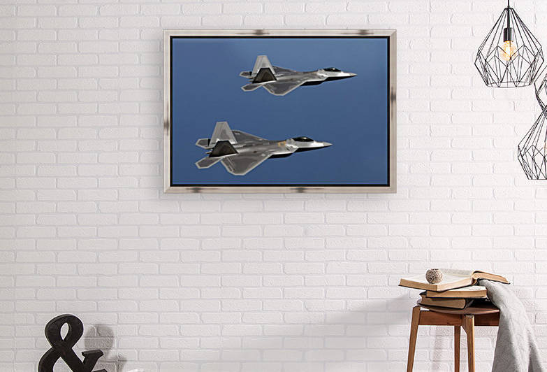F-22A Raptors fly over Langley Air Force Base Virginia. by StocktrekImages