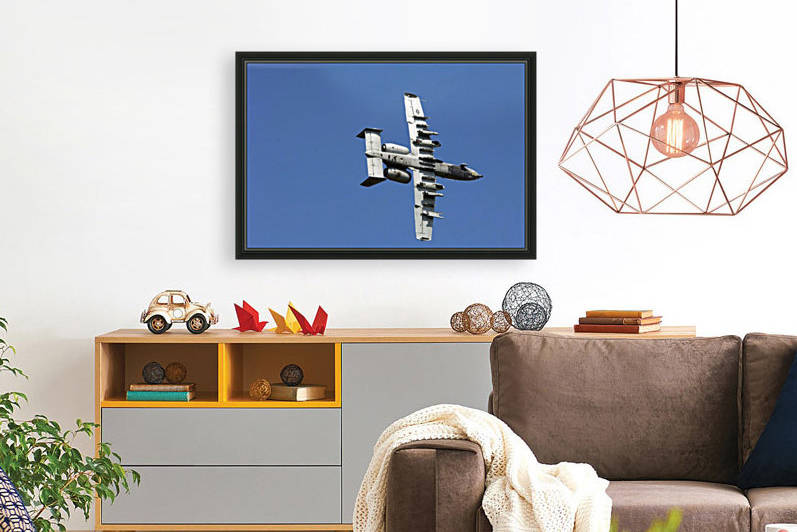 An A-10 Thunderbolt maneuvers through the sky. by StocktrekImages