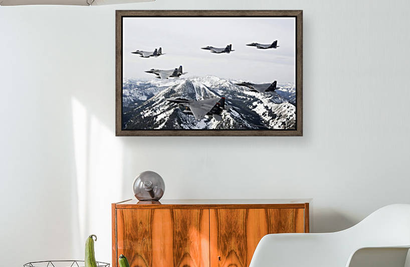 A six-ship formation of aircraft fly over the Sawtooth Mountains in Idaho. by StocktrekImages