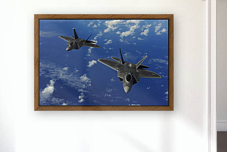 U.S. Air Force F-22 Raptors in flight near Guam. by StocktrekImages