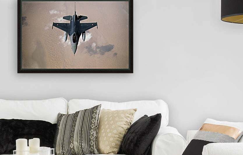 An Emirati F-16 disconnects from a KC-10A Extender after refueling during a multinational exercise. by StocktrekImages