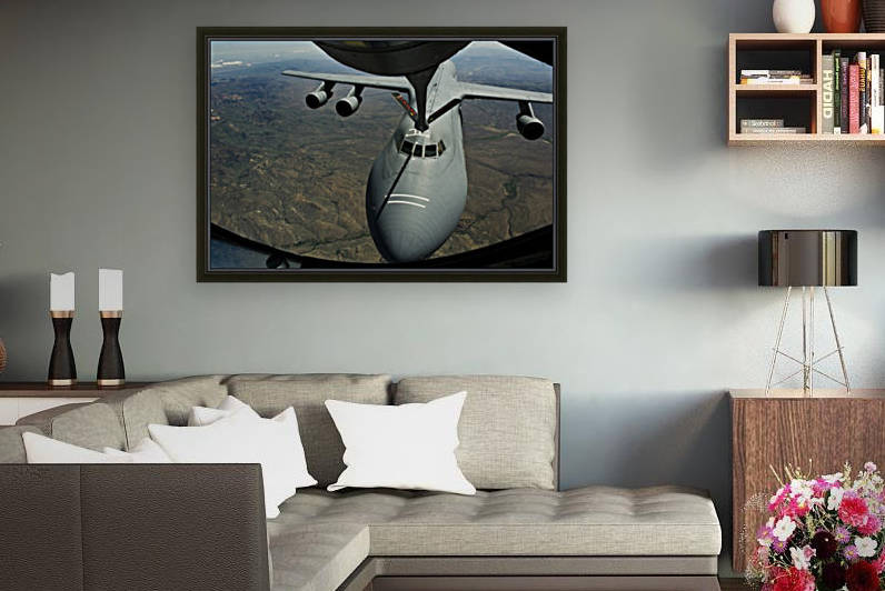 A U.S. Air Force KC-135R Stratotanker aircraft refuels a C-5B Galaxy. by StocktrekImages