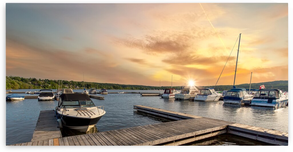 A boat waiting for a ride on a lake near Georgian Bay and Blue Mountain resort in Muskoka Ontario by Elijah Lovkoff