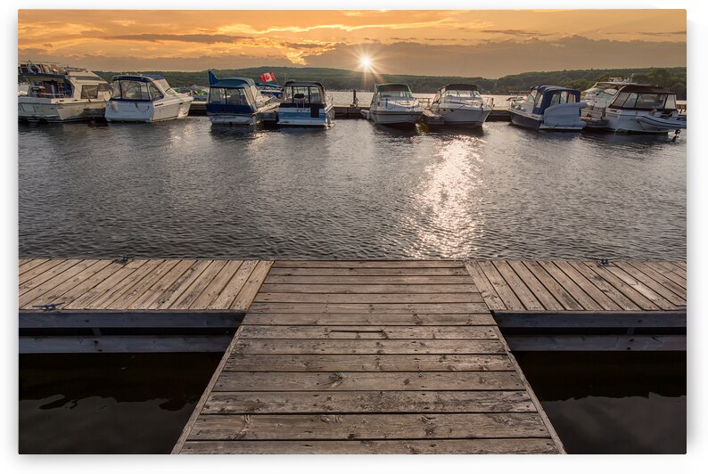 A boat waiting for a ride on a lake near Georgian Bay and Blue Mountain resort in Muskoka Ontario by Elijah Lovkoff