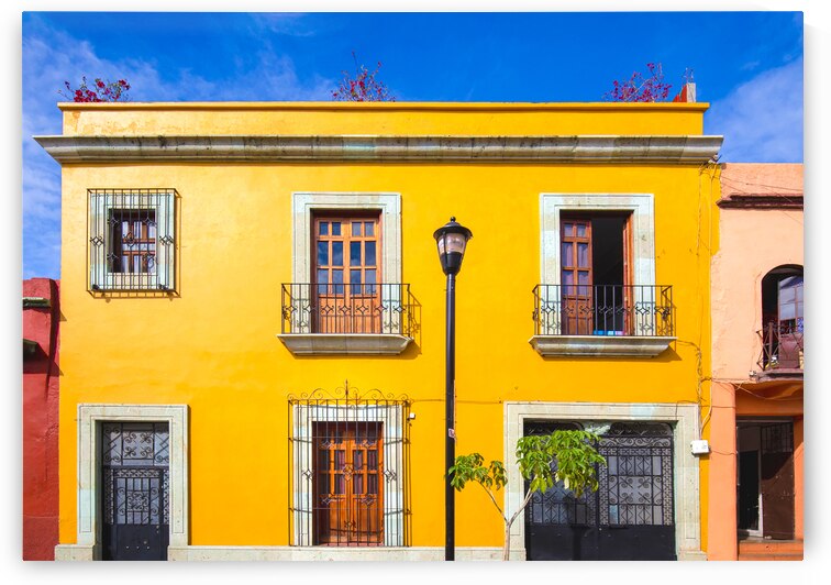 Oaxaca Mexico Scenic old city streets and colorful colonial buildings in historic city center by Elijah Lovkoff
