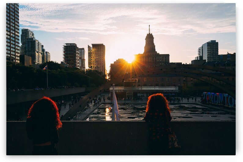 TORONTO CANADA MARCH 16 2017: Tourists enjoying a sunset on To by Elijah Lovkoff