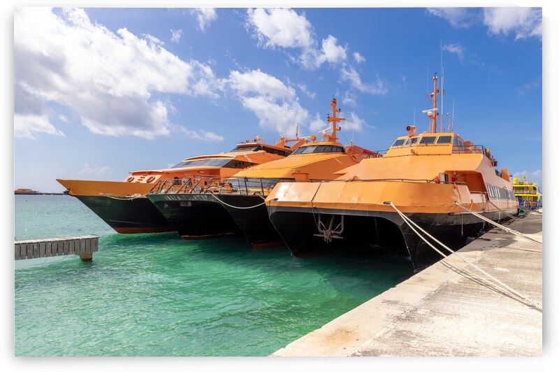 High speed Cozumel ferry at the terminal of San Miguel de Cozumel waiting for passengers to Playa del Carmen and other tourist destinations by Elijah Lovkoff