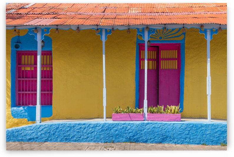 Colorful colonial architecture of historic center of Flores Guatemala by Elijah Lovkoff