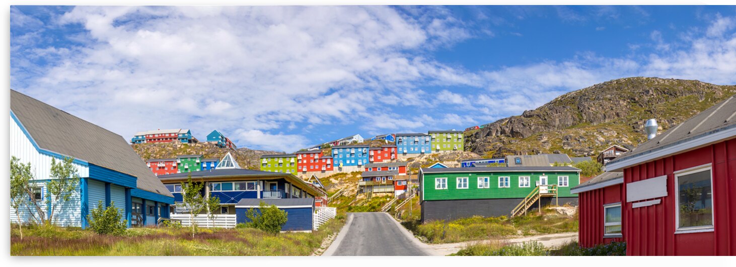 Typical architecture of Greenland city Qarqotoq with colored houses located near fjords and icebergs by Elijah Lovkoff