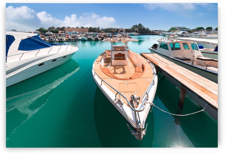 United Arab Emirates Abu Dhabi waterfront marina in downtown with yachts and water sport activity by Elijah Lovkoff