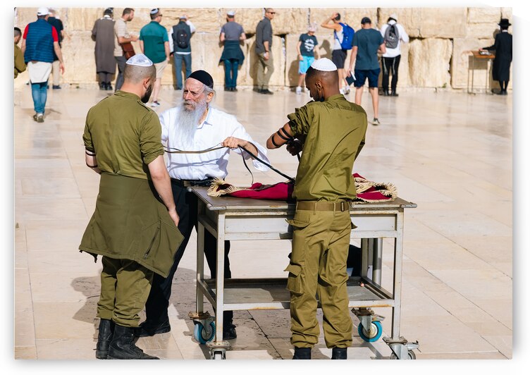 Tefillin ritual performed in front of Sacred Western Wall in Jerusalem Old City Jewish Temple by Elijah Lovkoff