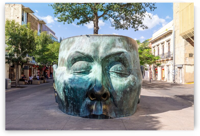 Tourist destination Arbol Adentro face Statue in Guadalajara historic city center favoured by tourists and locals alike by Elijah Lovkoff