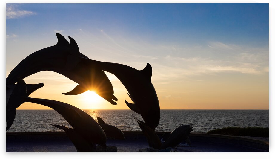 Dolphine silhouettes at Mazatlan sea promenade El Malecon with ocean lookouts tourist beaches and scenic landscapes. It connects Old Mazatlan with Hotel Zone Zona Hotelera by Elijah Lovkoff