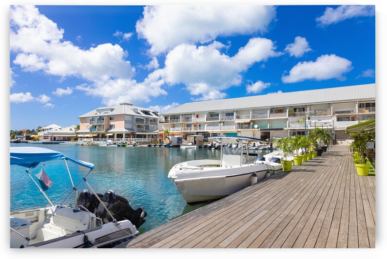 Saint Martin Marigot waterfront marina with yachts restaurants and water sport activity by Elijah Lovkoff