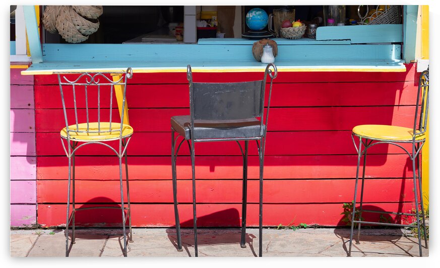 Caribbean cruise vacation. Colorful street cafe in Marigot in Saint Martin by Elijah Lovkoff