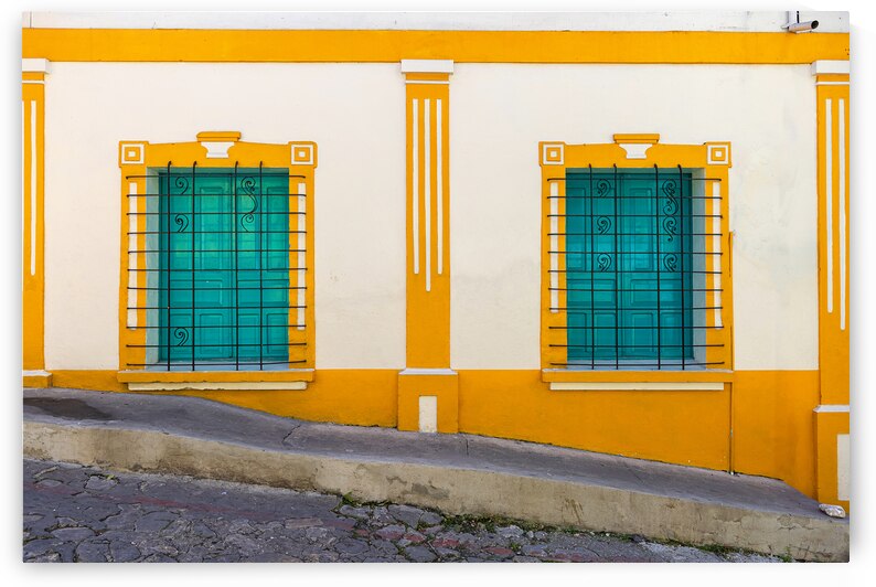 Colorful colonial architecture of historic center of Flores Guatemala by Elijah Lovkoff