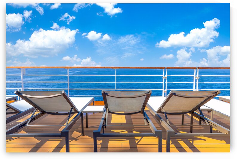 Luxury cruise ship sailing in the sea on Caribbean vacation. Scenic ocean views from deck by Elijah Lovkoff