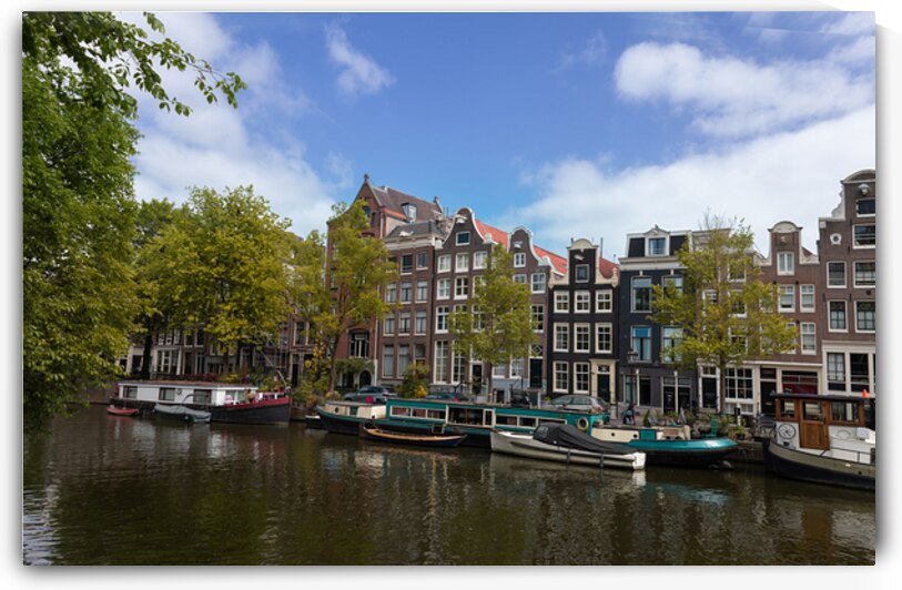 Holland Amsterdam canals with scenic bridges and historic city center UNESCO World Heritage site by Elijah Lovkoff