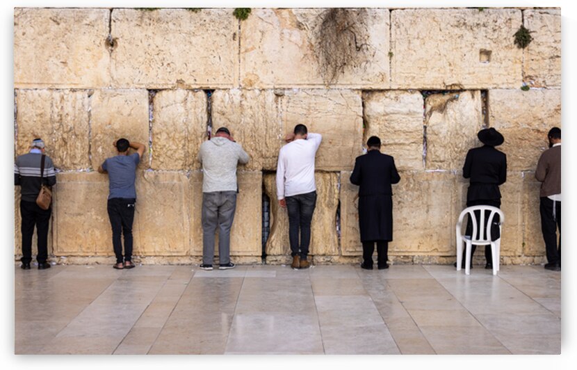Orthodox and secular jews pray near Sacred Western Wailing Wall in Jerusalem Old City by Elijah Lovkoff