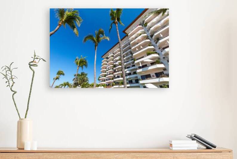 Luxury condominiums and apartments on Playa De Los Muertos beach and pier close to the famous Puerto Vallarta Malecon the city largest public beach by Elijah Lovkoff