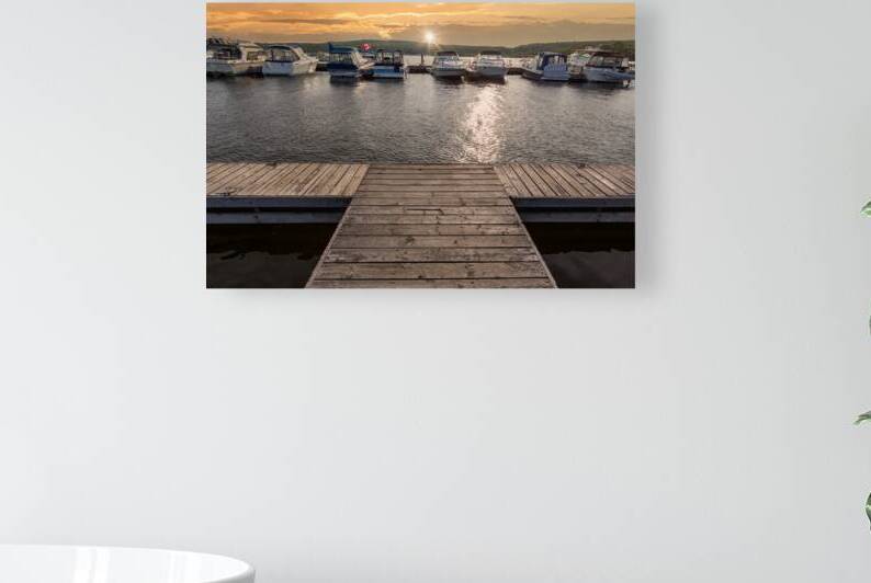 A boat waiting for a ride on a lake near Georgian Bay and Blue Mountain resort in Muskoka Ontario by Elijah Lovkoff