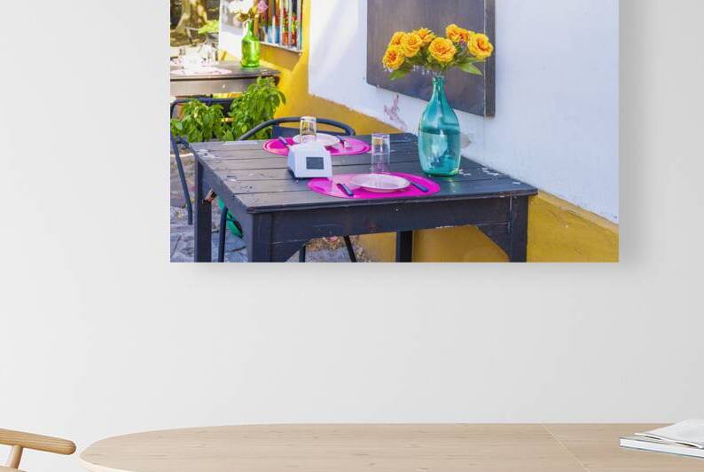 Uruguay restaurant table in Colonia Del Sacramento in historic center of Barrio Historico by Elijah Lovkoff