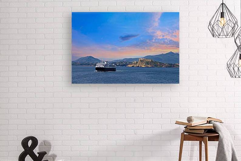 Italy scenic sunset over Procida Island near Naples with boat approaching it from afar by Elijah Lovkoff
