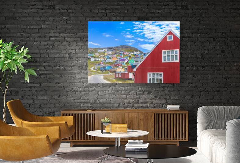 Typical architecture of Greenland city Qarqotoq with colored houses located near fjords and icebergs by Elijah Lovkoff