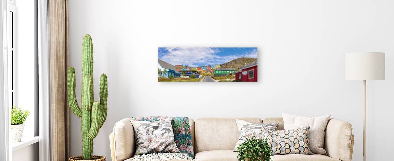 Typical architecture of Greenland city Qarqotoq with colored houses located near fjords and icebergs by Elijah Lovkoff