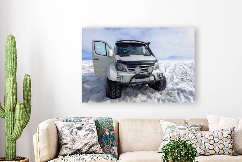 Glacier trucks and special cars driving people over Langjokull Glacier to man made ice tunnels by Elijah Lovkoff
