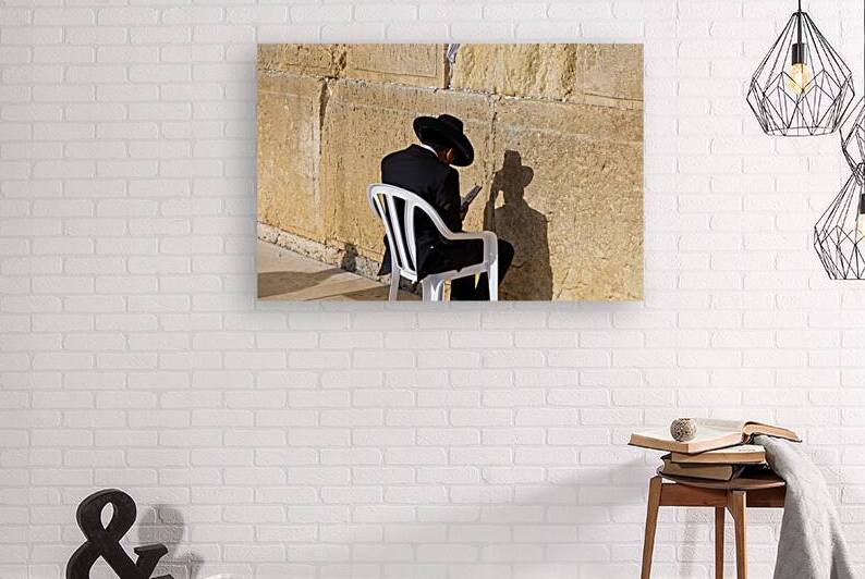 Orthodox jew is praying in front of Sacred Western Wall in Jerusalem Old City Jewish Temple by Elijah Lovkoff