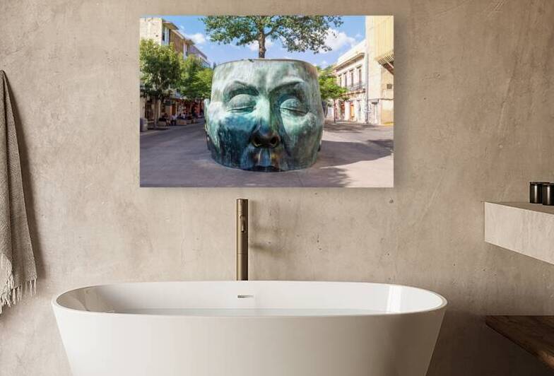 Tourist destination Arbol Adentro face Statue in Guadalajara historic city center favoured by tourists and locals alike by Elijah Lovkoff