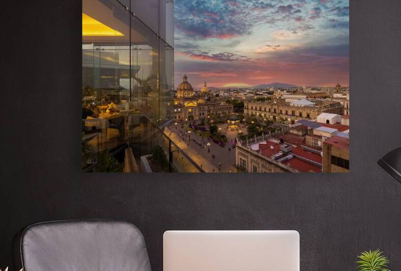 Dinner at a restaurant in a trendy hotel overlooking scenic panoramic view of the main Guadalajara square and Guadalajara Cathedral and city skyline by Elijah Lovkoff