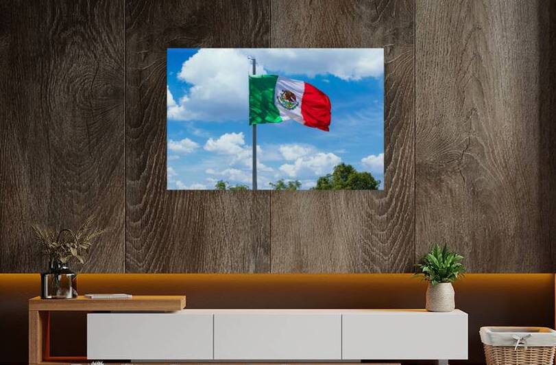 Los Cabos Mexico Mexican tricolor national striped flag proudly waving at mast in the air with Aztec symbol for Tenochtitlan by Elijah Lovkoff