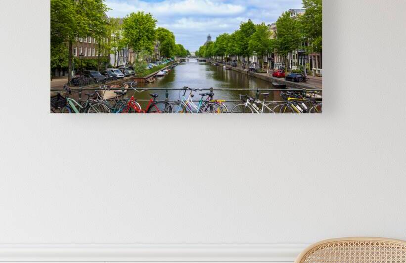 Holland Amsterdam canals with scenic bridges and historic city center UNESCO World Heritage site by Elijah Lovkoff