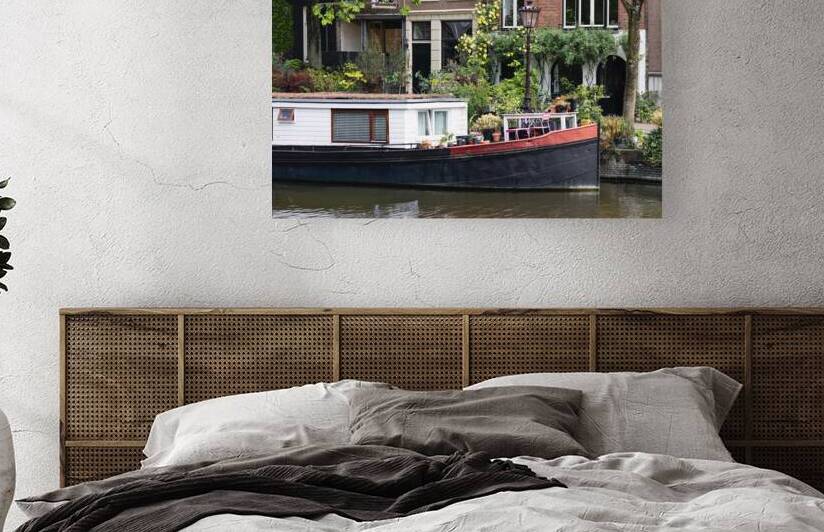 Holland Amsterdam canals with boats scenic bridges and historic city center UNESCO World Heritage site by Elijah Lovkoff