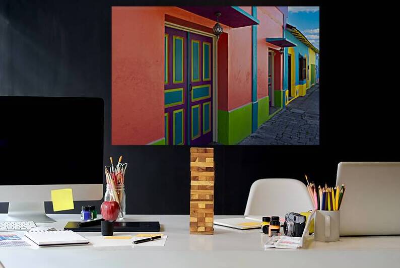 Colorful colonial architecture of historic center of Flores Guatemala by Elijah Lovkoff
