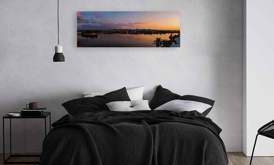 Scenic sunsets and colourful colonial architecture of historic center of Flores Guatemala. View of lake Peten Itza Flores Lake by Elijah Lovkoff