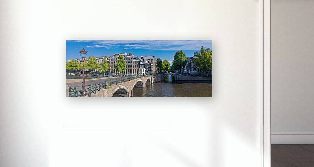 Holland Amsterdam canals with boats scenic bridges and historic city center UNESCO World Heritage site by Elijah Lovkoff