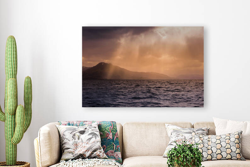 Sun peaking through rain clouds by Aperture Adventure Delaney Van