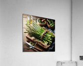 311 fresh thin green asparagus on a wooden table. Acrylic Print