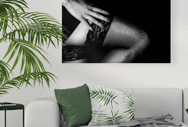 Black and white image of female seductive legs in fishnet stocki by Jelena Jovanovic Fine Art