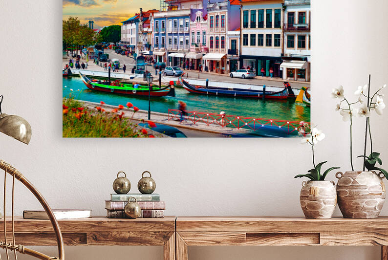 Traditional boats on the canal in Aveiro Portugal.  by Carlos Castilla
