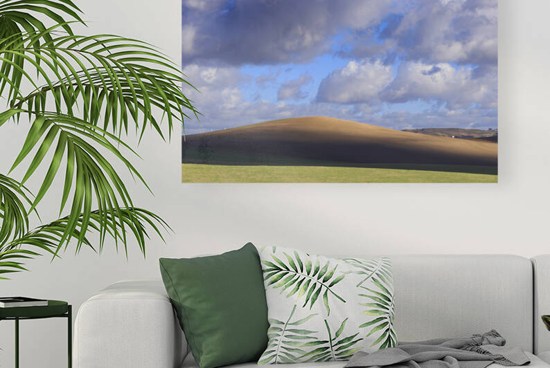 Hilly landscape with plowed land dominated by clouds in Apulia Italy. by Giuseppe Colasanto