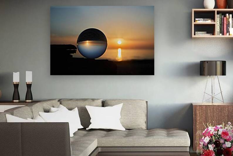 View on a sunset over ocean coast through a glass ball. Selectiv by Vetre