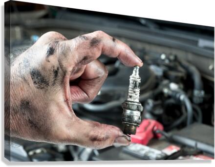 Auto mechanic and sparkplug Canvas Print