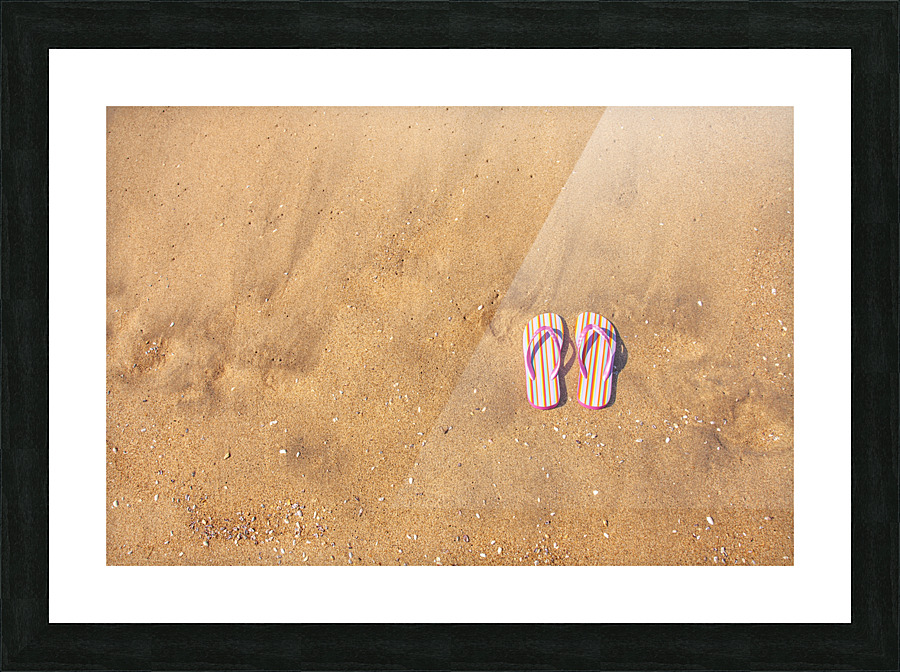 Flip flops on sand Picture Frame print