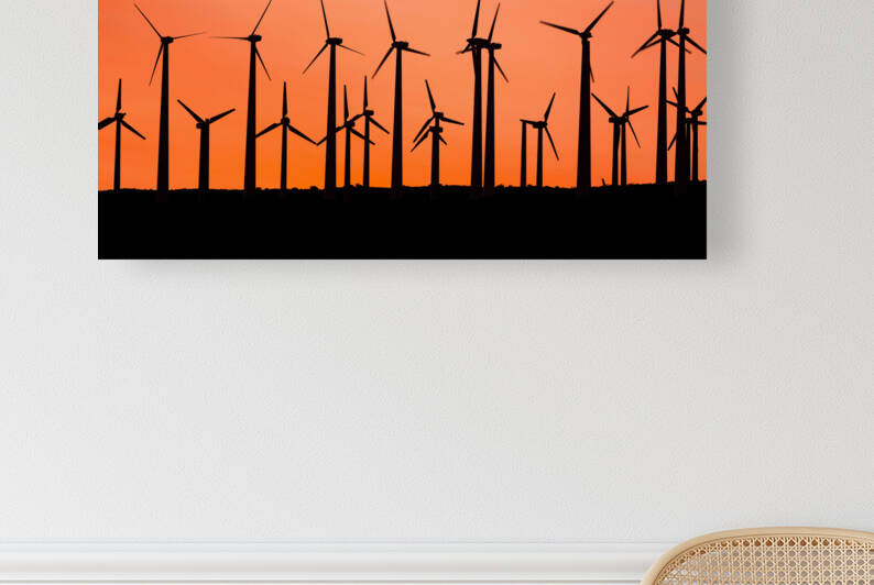 Windmill silhouette at sunset by Joe Belanger