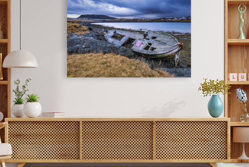 Old wooden ship on beach by Joe Belanger