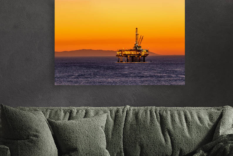 Offshore oil platform at dusk by Joe Belanger